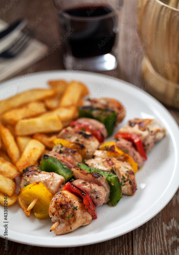 Chicken skewers with fries. High quality photo. Chicken skewers with fries. High quality photo.