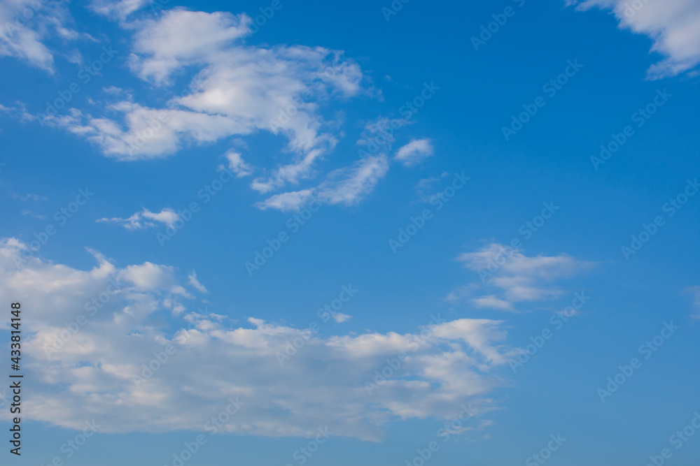 Blue sky and white clouds, the freshness of the new day. The bright blue background gives a feeling of relaxation as in the sky, the scenery of the blue sky and the light of the sun.