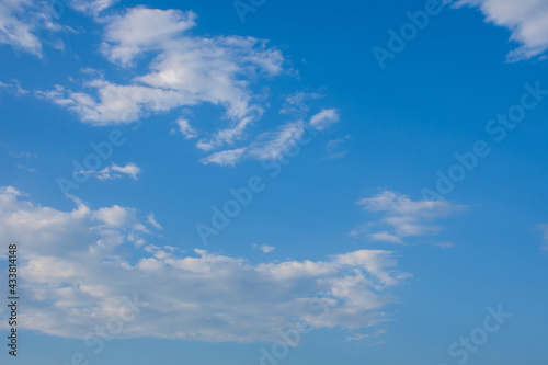 Blue sky and white clouds  the freshness of the new day. The bright blue background gives a feeling of relaxation as in the sky  the scenery of the blue sky and the light of the sun.
