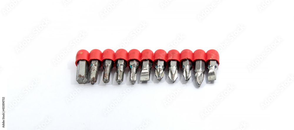 Set of screwdriver metal bits over white isolated background. Set of screwdriver metal bits over white isolated background.