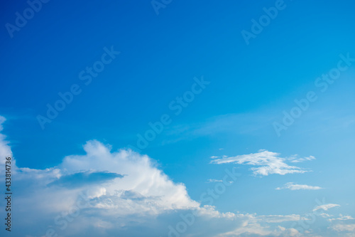 Fototapeta Naklejka Na Ścianę i Meble -  Blue sky and white clouds, the freshness of the new day. The bright blue background gives a feeling of relaxation as in the sky, the scenery of the blue sky and the light of the sun.