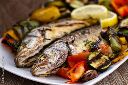 Sea bass with grilled vegetables. High quality photo.