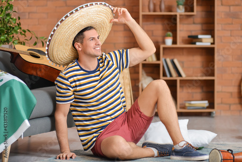 Handsome man in sombrero ha...