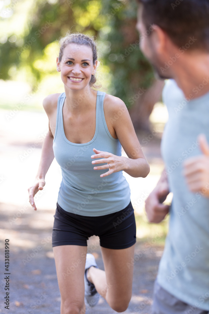 Fototapeta premium young couple running in nature