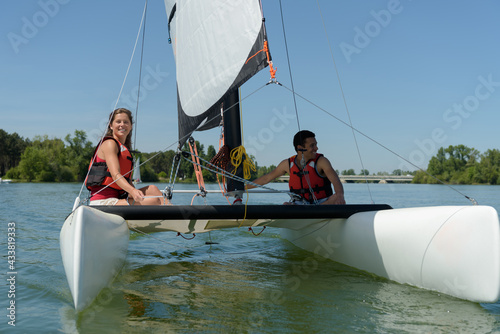 couple in love on a sail boat in the summer