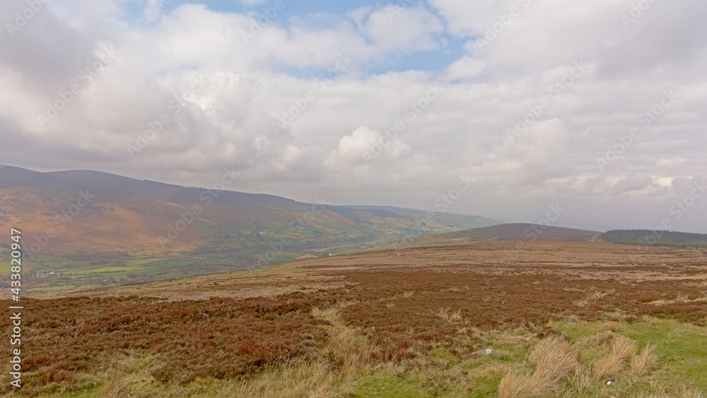 Wicklow mountains with plateau with brown peatland on a cloudy day. Dublin, Ireland 