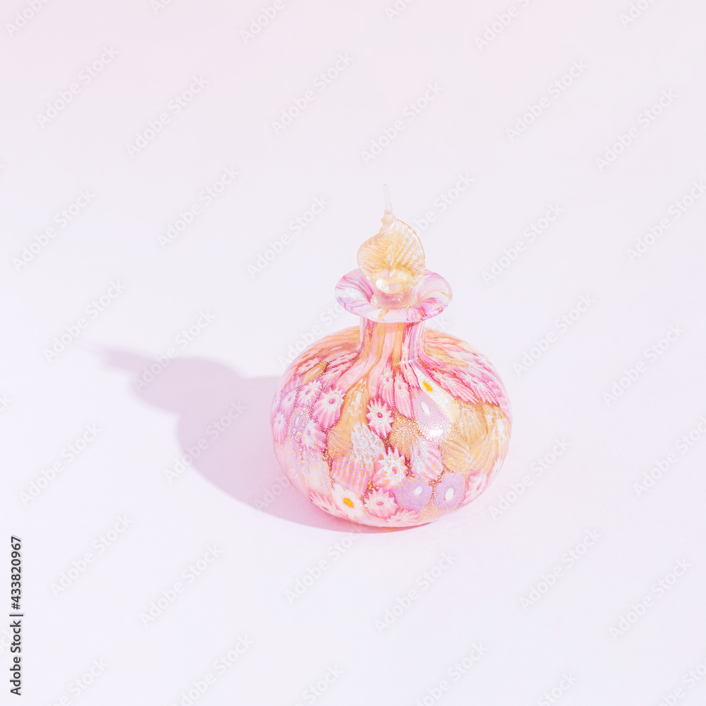 Elegant glass rose vase on a pink background. Elegant glass rose vase on a pink background.