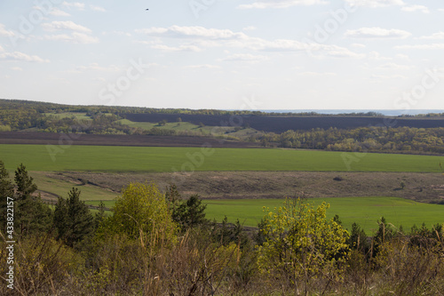 spring landscape overlooking agricultural fields from the top of the mountain