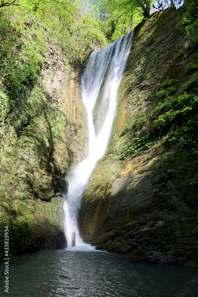 Obraz premium Orekhovsky Waterfall in the vicinity of Sochi, a popular tourist route