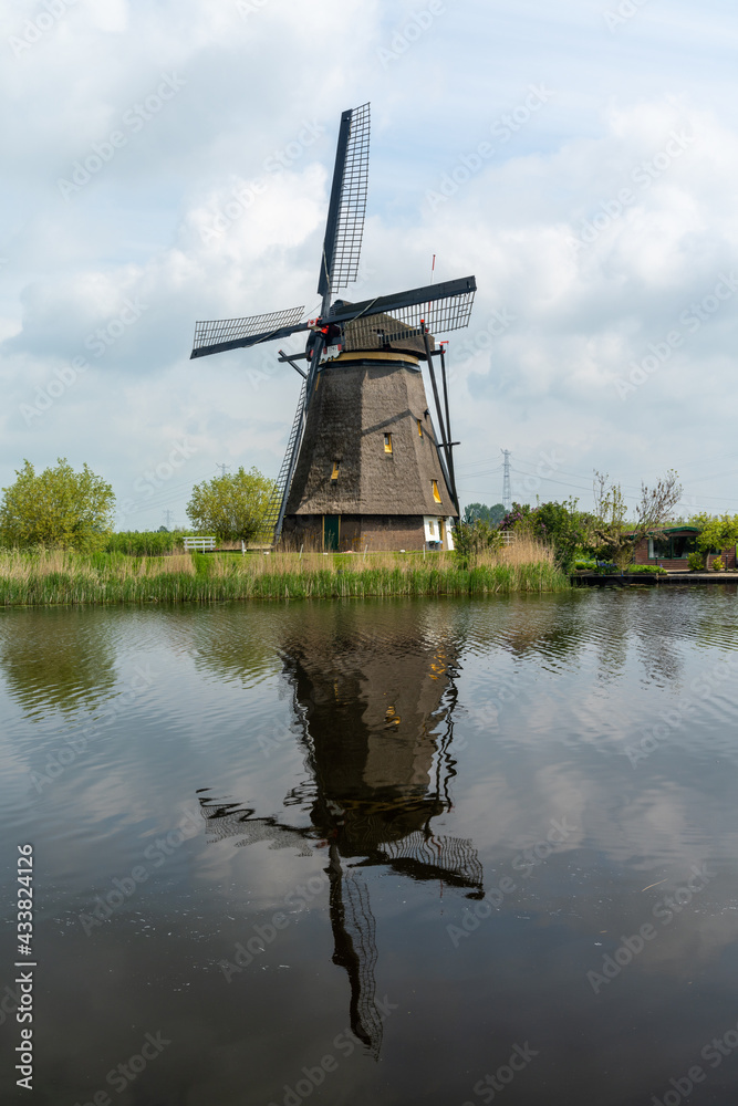 vertical view of a historic 18-century windmill at Kinderdijk in South Holland