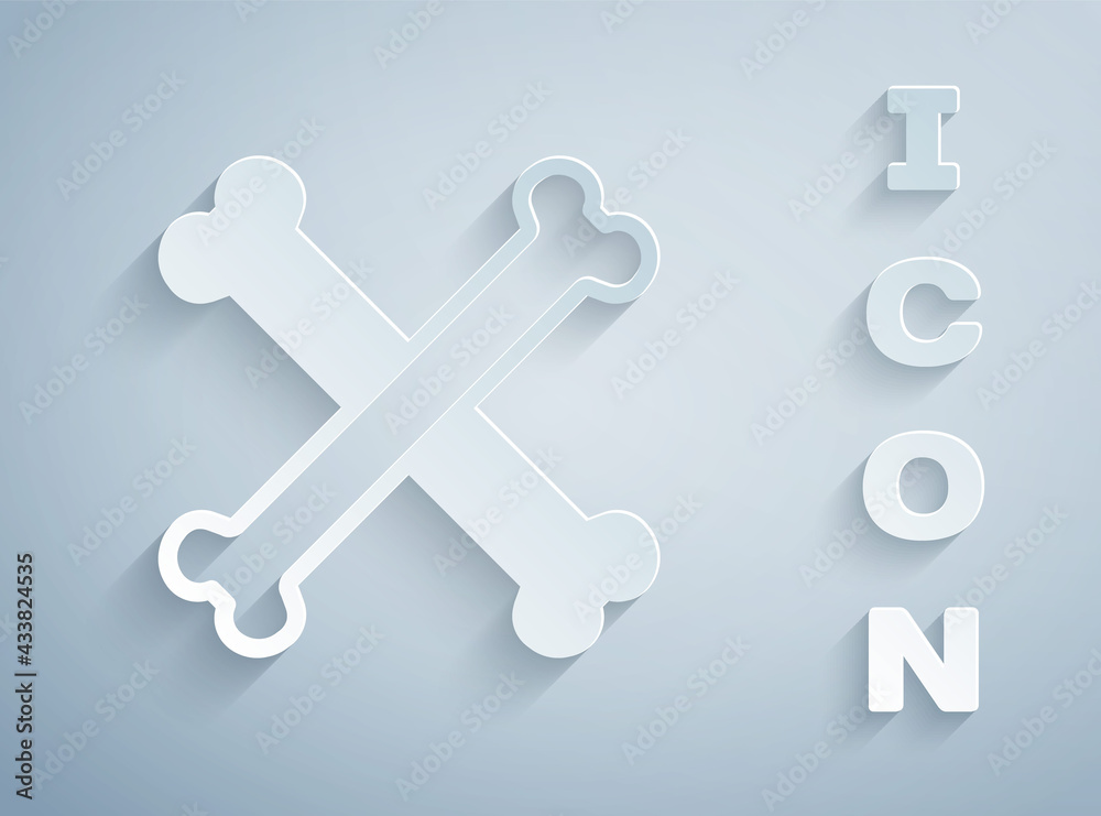 Paper cut Crossed bones icon isolated on grey background. Pets food symbol. Happy Halloween party. Paper art style. Vector Paper cut Crossed bones icon isolated on grey background. Pets food symbol. Happy Halloween party. Paper art style. Vector