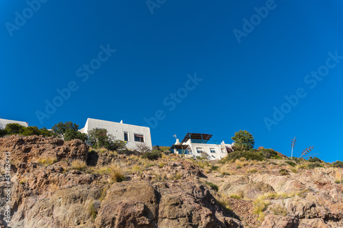 White houses on the top of San Jose beach in the town of Nijar, Almería. Andalusian coast in Cabo de Gata. Spain