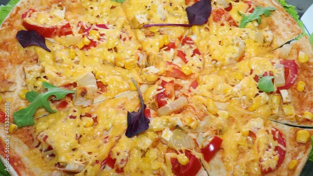 Large and delicious pizza close-up. Camera raid Large and delicious pizza close-up. Camera raid