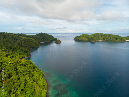 Beautiful shot of the sea under a blue cloudy sky in Indonesia photo