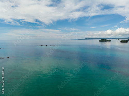 Beautiful shot of the sea under a blue cloudy sky in Indonesia photo