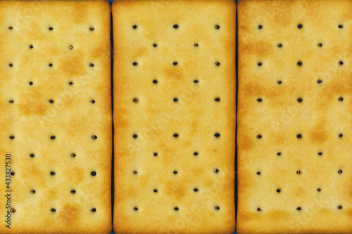 Cracker surface with many small holes as background, texture, patern. photo