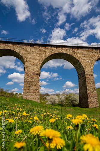 Old railway stone viaduct in the spring in sunny day. photo