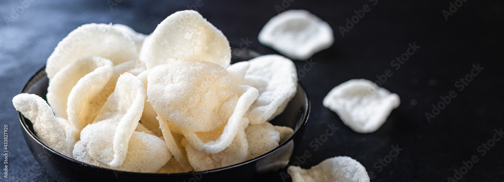 tapioca or rice chips snack meal copy space food background rustic. top view keto or paleo diet vegan or vegetarian food tapioca or rice chips snack meal copy space food background rustic. top view keto or paleo diet vegan or vegetarian food