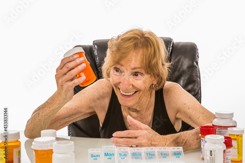 Senior Woman Happy With Pills She Takes For Her Pill Box photo