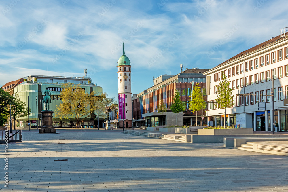 Fototapeta premium Panoramic view over the Friedensplatz to the white tower in the city center of the Hessian university town Darmstadt in Germany