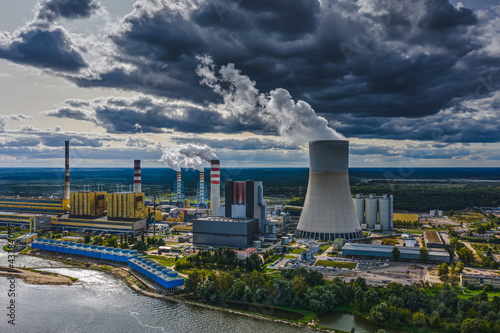 Power station under moody cloudy sky aerial view photo