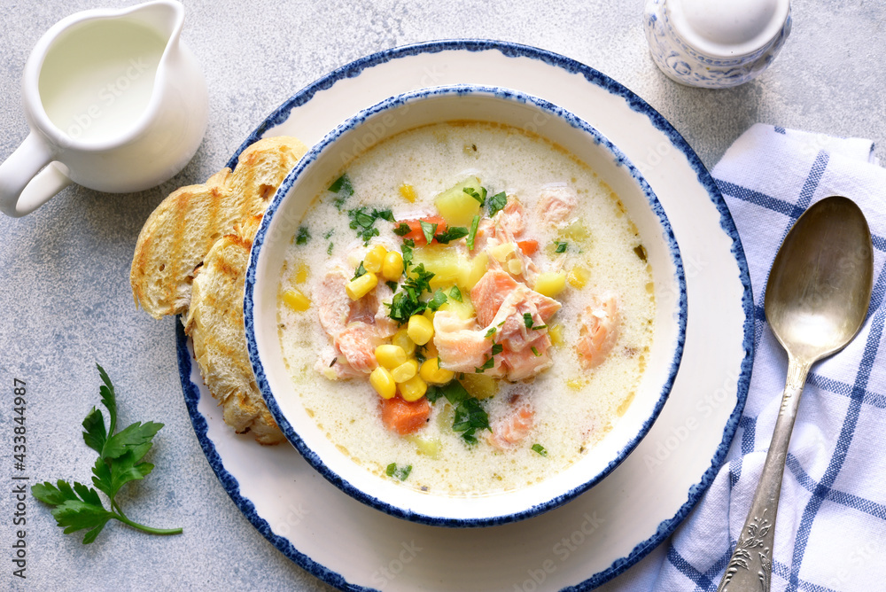 Chowder - thick potato soup with trout ( salmon ) and cream. Top view with copy space. Chowder - thick potato soup with trout ( salmon ) and cream. Top view with copy space.
