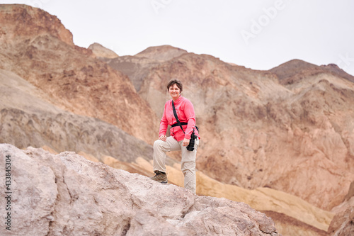 A family with a teenage girl is hiking Dante’s View trail in Death Valley National Park in California, USA during their road trip from Las Vegas to San Francisco in March 2021 during COVID-19 pandemic © Karina Eremina