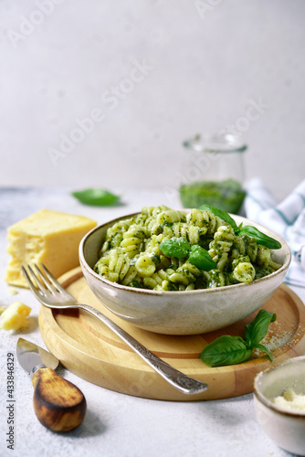 Fototapeta Naklejka Na Ścianę i Meble -  Fusilli pasta with pesto sauce - traditional dish of italian cuisine.