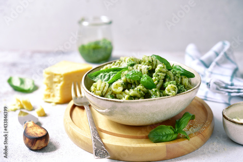 Fusilli pasta with pesto sauce - traditional dish of italian cuisine.