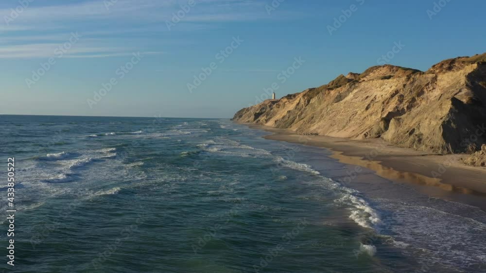 Drone Flight Over Coastline To Rubjerg Knude Lighthouse, Hjorring, Denmark Drone Flight Over Coastline To Rubjerg Knude Lighthouse, Hjorring, Denmark