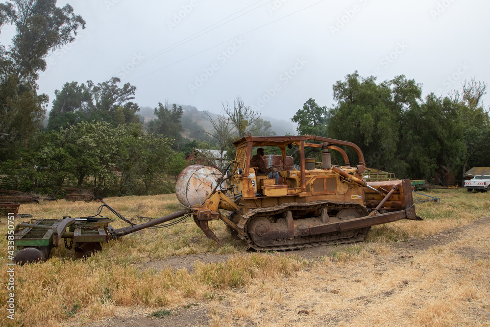 Fototapeta premium Bull Dozer Pulling Discs
