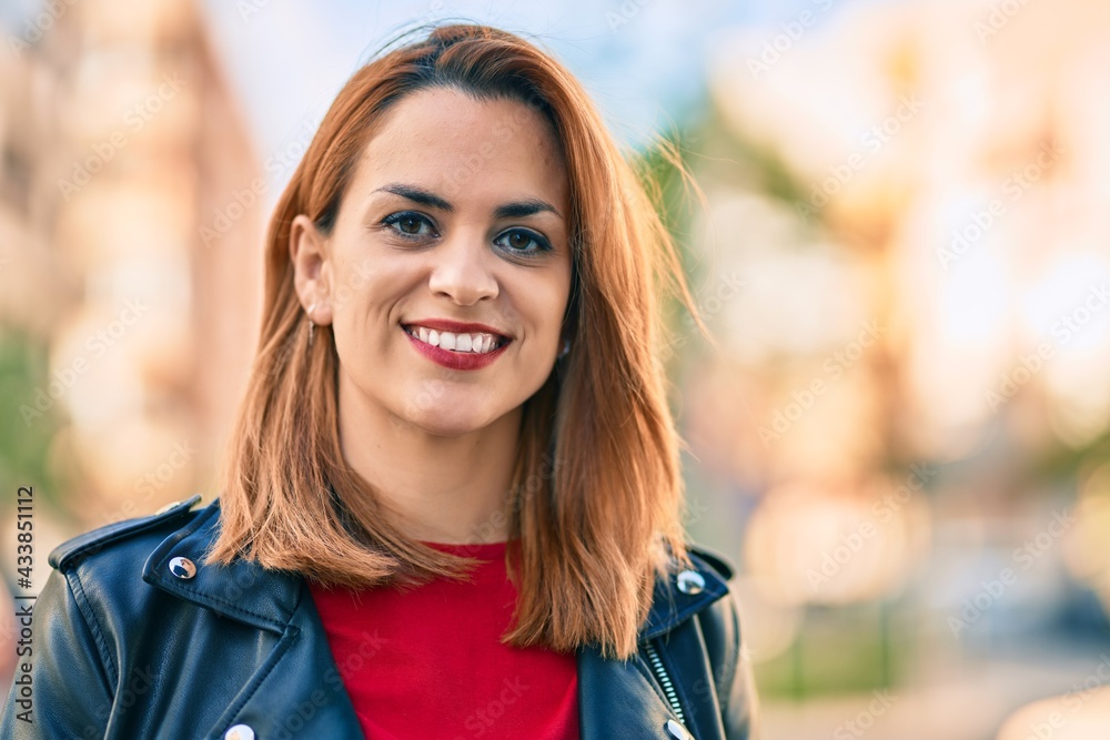 Young latin woman smiling happy standing at the city. Young latin woman smiling happy standing at the city.