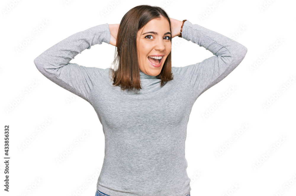 Young beautiful woman wearing casual turtleneck sweater relaxing and stretching, arms and hands behind head and neck smiling happy Young beautiful woman wearing casual turtleneck sweater relaxing and stretching, arms and hands behind head and neck smiling happy