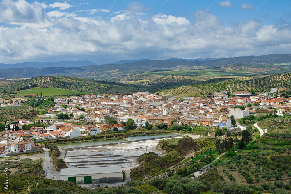 Fototapeta premium View of La Malahá, a municipality in the province of Granada (Spain), with its famous salines in the foreground, exploited since the time of Roman domination