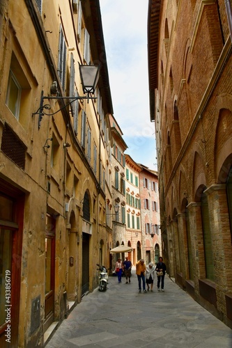 Narrow Walking Street Alley in Tuscany with Ochre-Colored Buildings