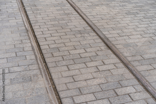 tram rails in cobblestone