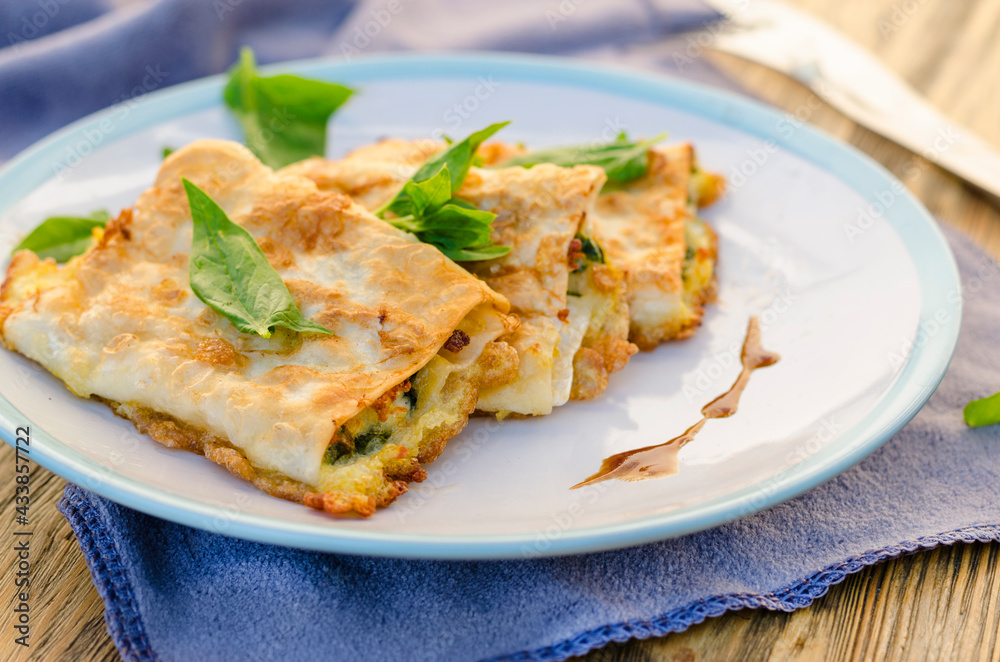 cottage cheese with spinach fried in pita bread