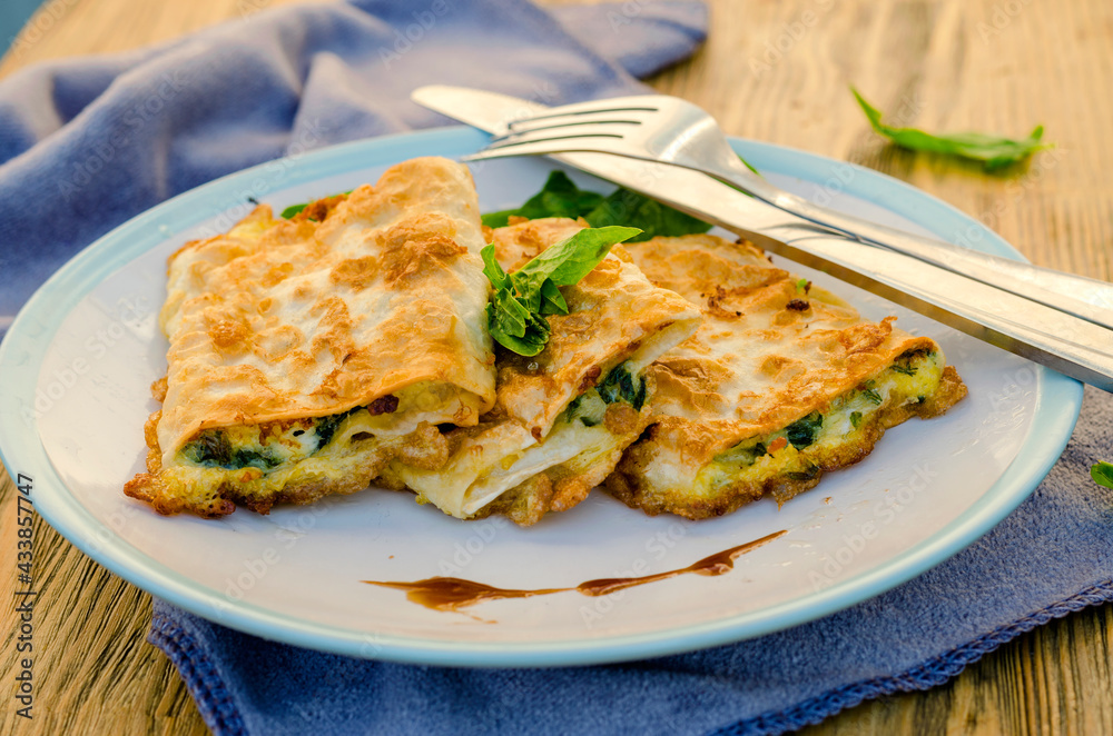 cottage cheese with spinach fried in pita bread