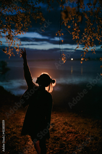 Silhouette of a girl at night.