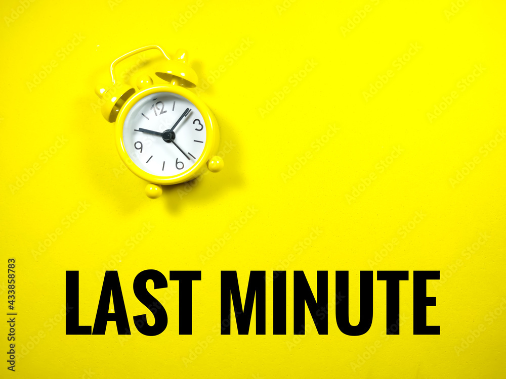 Text LAST MINUTE with alarm clock on yellow background. Text LAST MINUTE with alarm clock on yellow background.