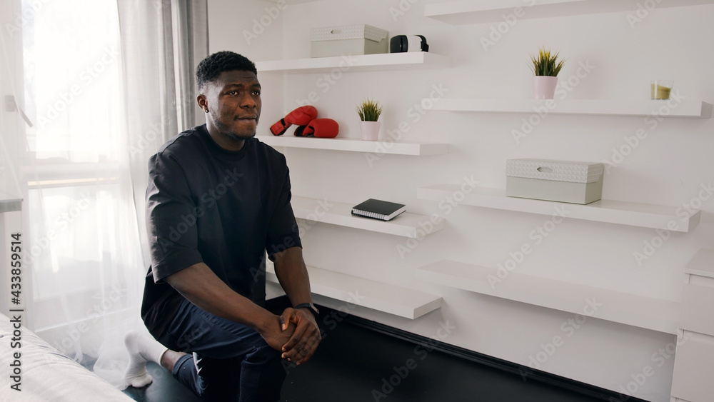 African American guy dressed black shirt warming up in front of a camera. High quality photo African American guy dressed black shirt warming up in front of a camera. High quality photo
