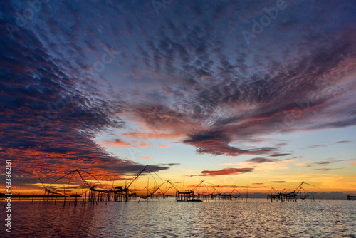Beautiful landscape morning sky sunrise, Fishing using giant nets Thale Noi Wetlands
