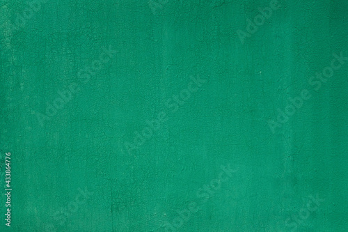 Green painted cracked wall background