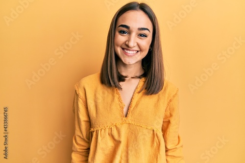 Young brunette girl wearing casual clothes with a happy and cool smile on face. lucky person. © Krakenimages.com