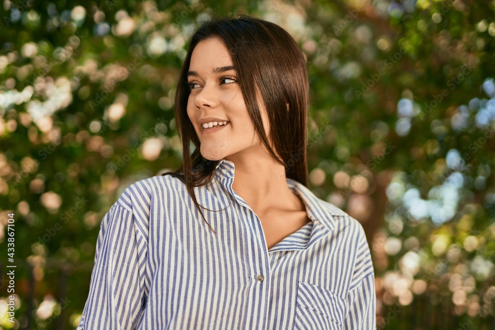 Young hispanic girl smiling happy standing at the city. Young hispanic girl smiling happy standing at the city.