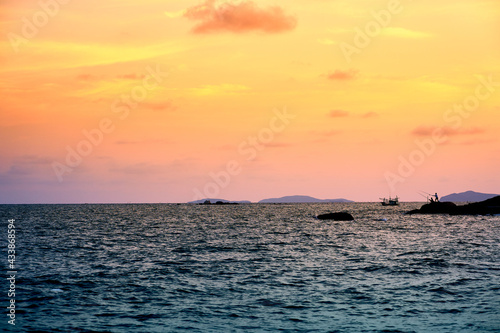 A picture of a fishing man in the evening At Phayun Beach, Ban Chang, Rayong, Thailand © pranchai