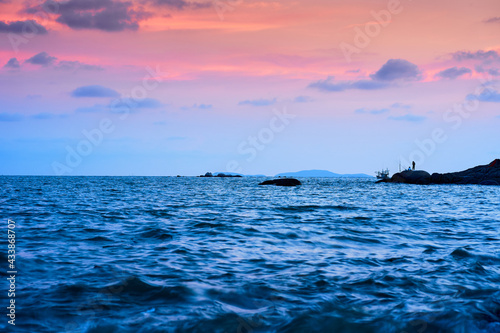 A picture of a fishing man in the evening At Phayun Beach, Ban Chang, Rayong, Thailand