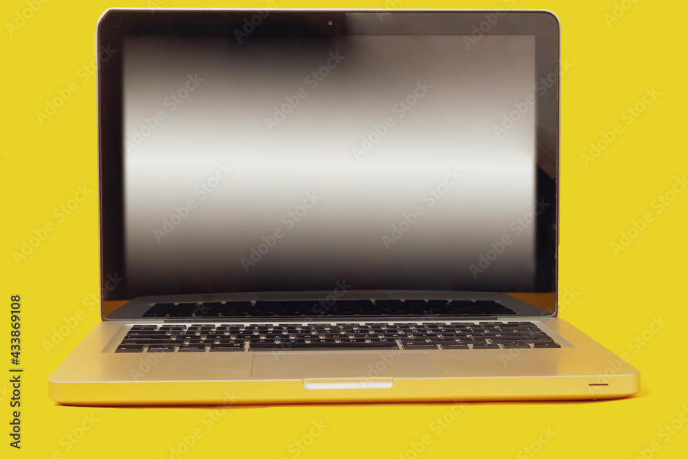 blank screen laptop isolated on yellow background with clipping path blank screen laptop isolated on yellow background with clipping path