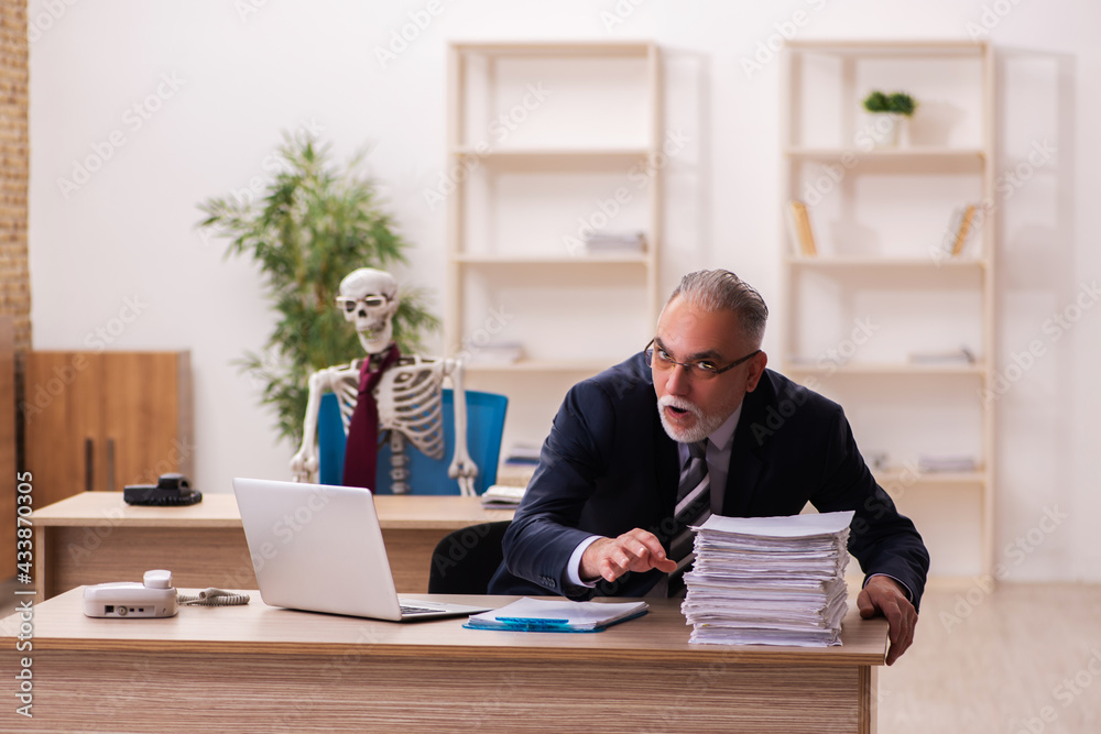 Dead employee working in the office Dead employee working in the office
