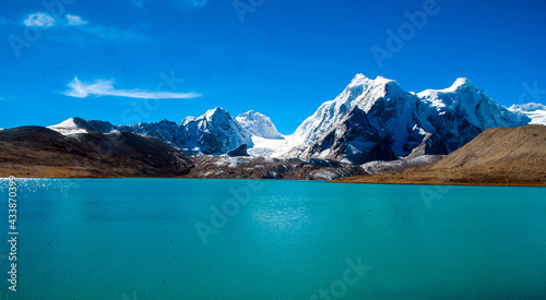 Gurudongmar Lake, Sikkim, India and it's way from Lachen, North Sikkim. A holy lake never fully freezes. It is said that Goutam Buddha drinks water from this lake. photo